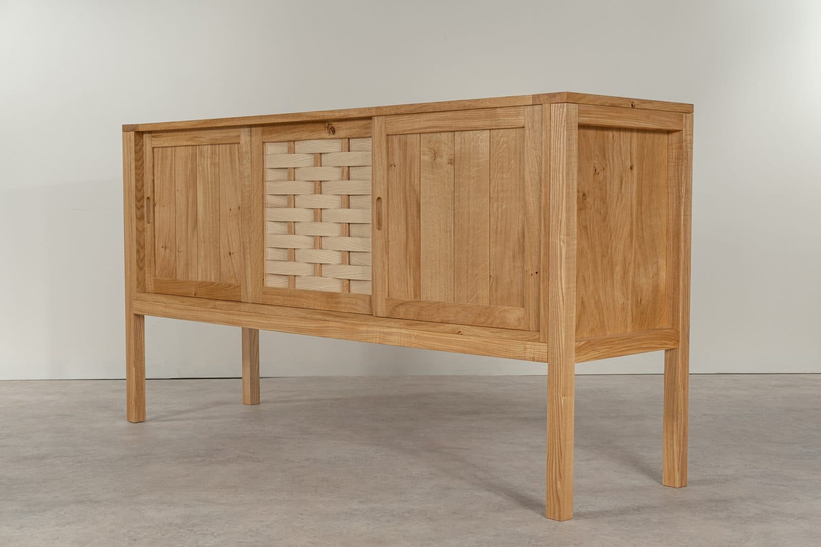 Oak sideboard with a woven door panel by David Wraith