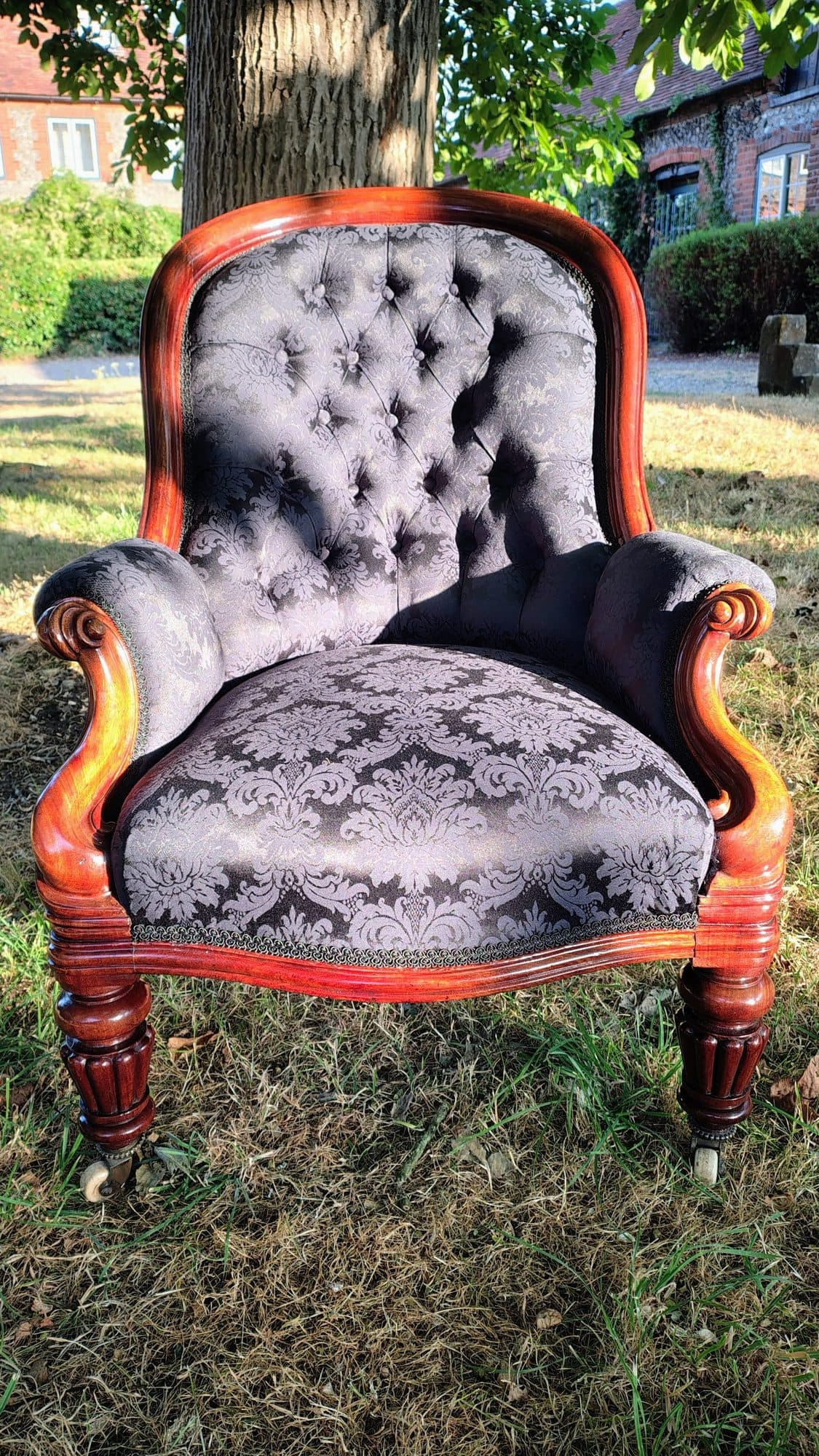 Alexandra Brady's deep-buttoned mahogany armchair, front view