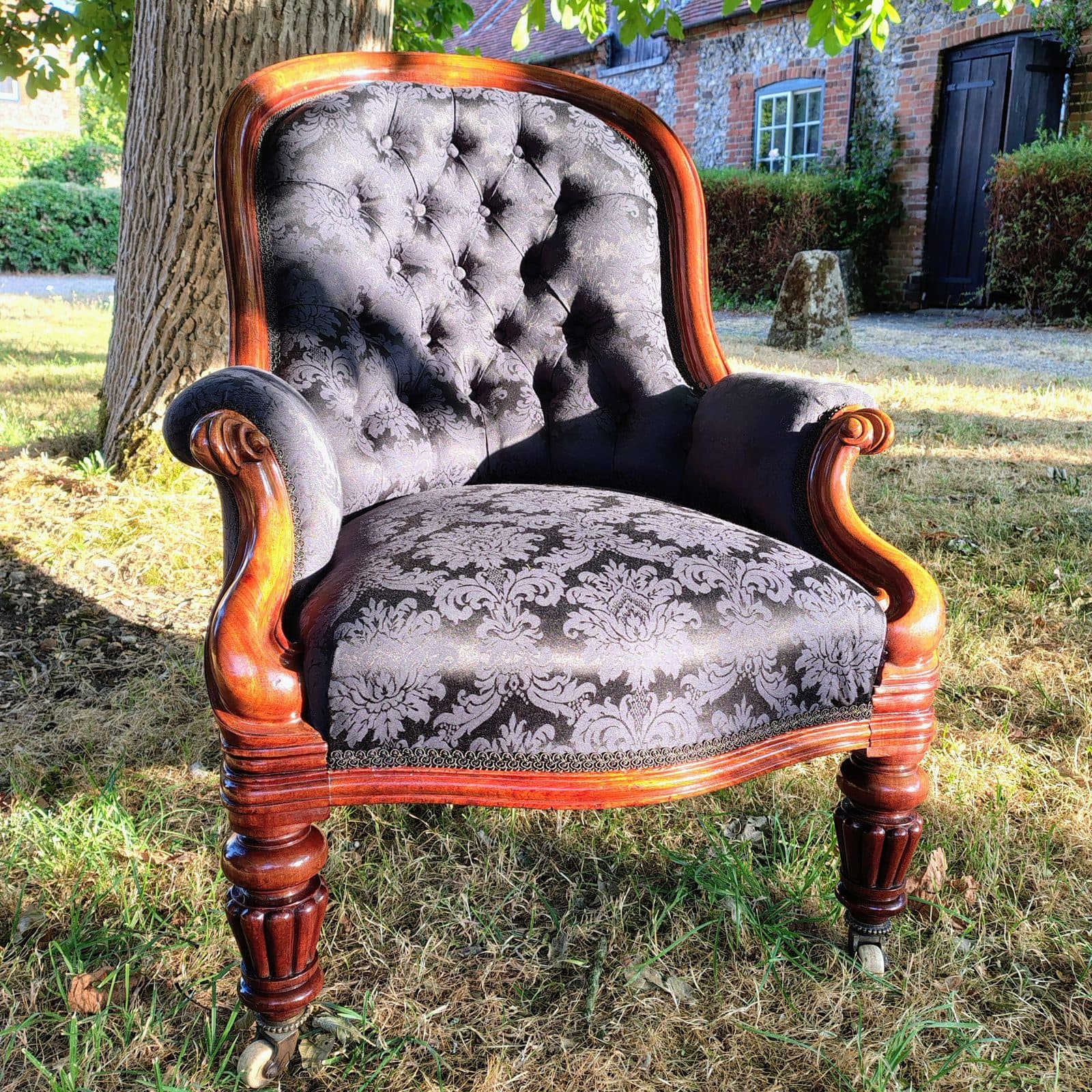 Alexandra Brady's deep-buttoned mahogany armchair