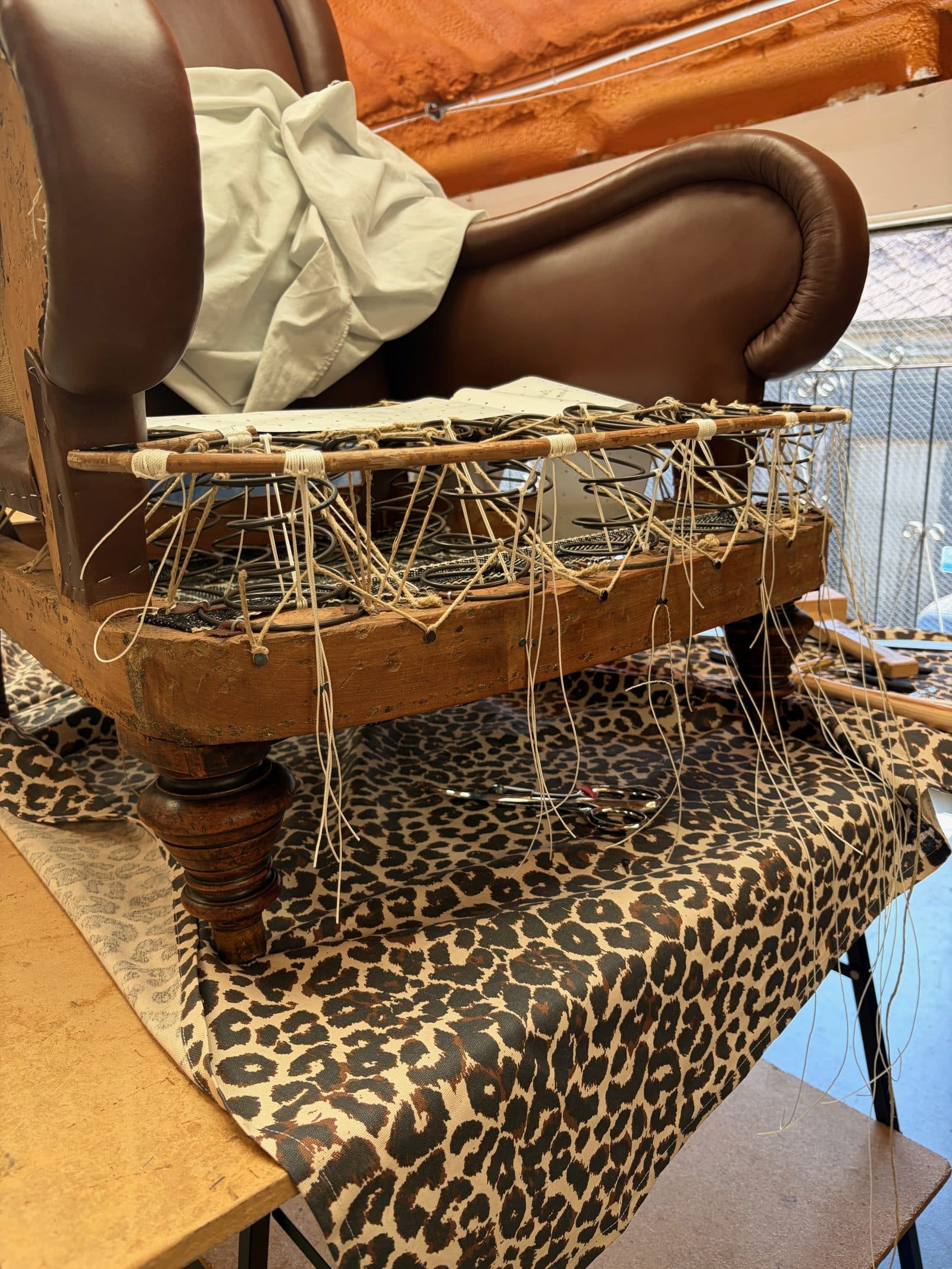 The seat rebuilt with new springs and a newly formed cane edge