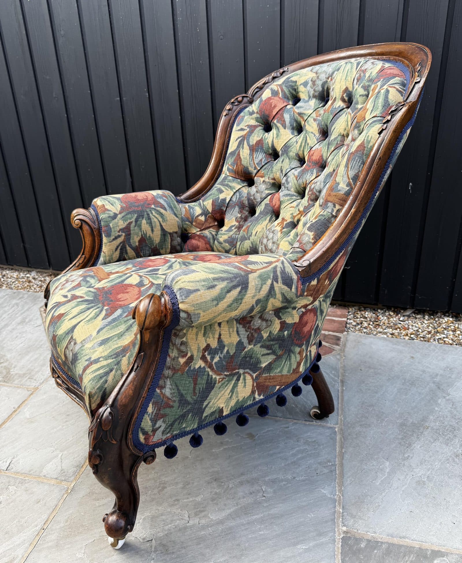 Emma Wrafter's mid to late Victorian mahogany armchair, deep-buttoned, three-quarter view