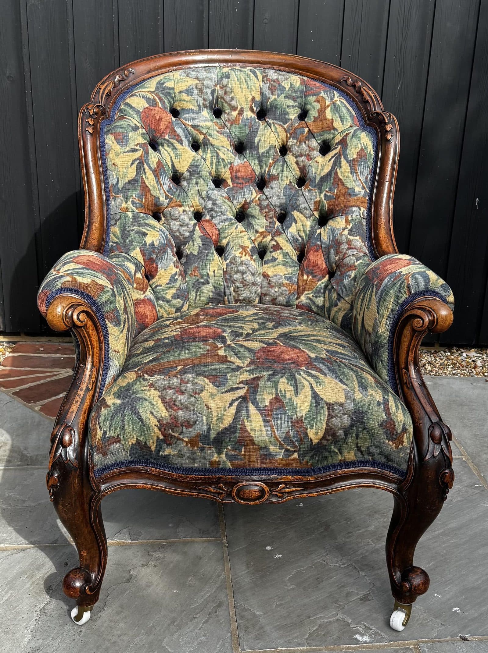 Emma Wrafter's deep-buttoned Victorian mahogany armchair in Hazleton House Syrah fabric