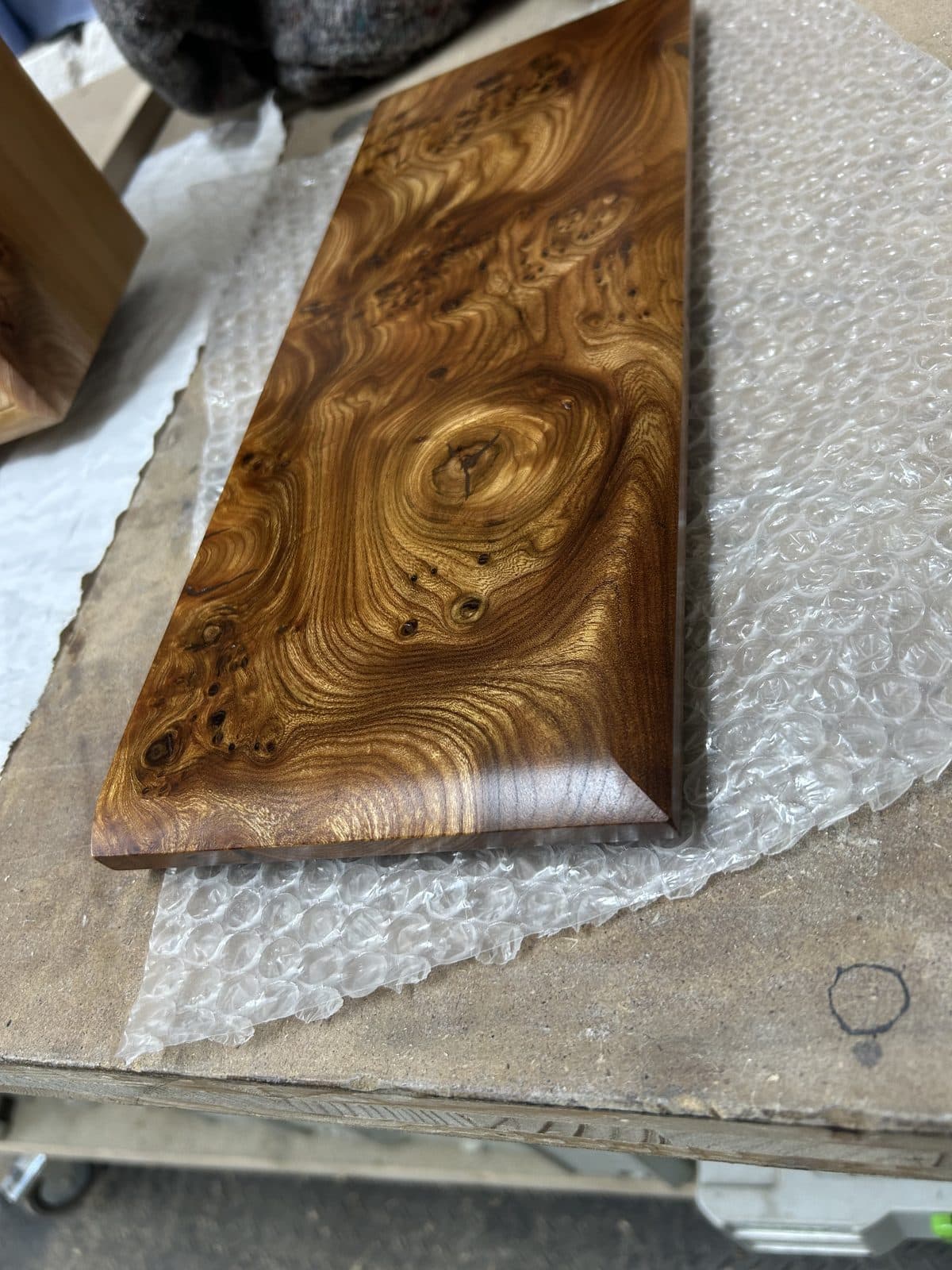 The figured Scottish elm of the cabinet top