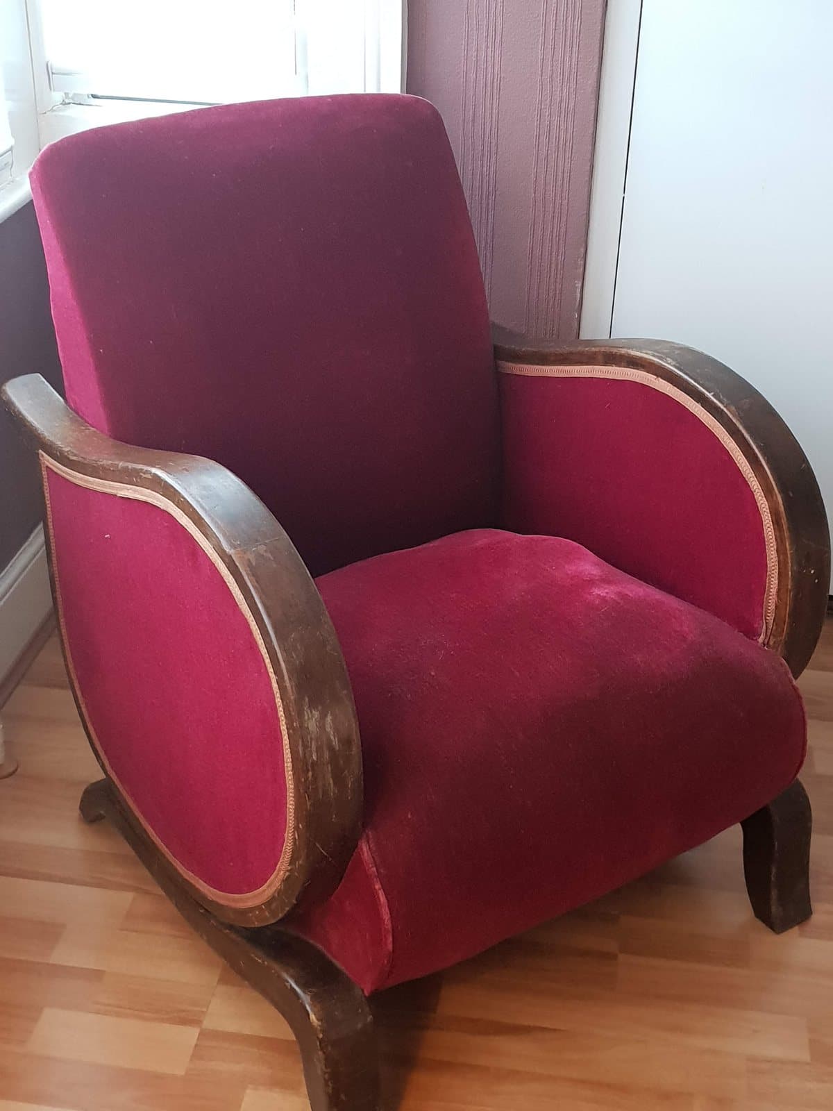 The recliner before restoration, in worn red velvet