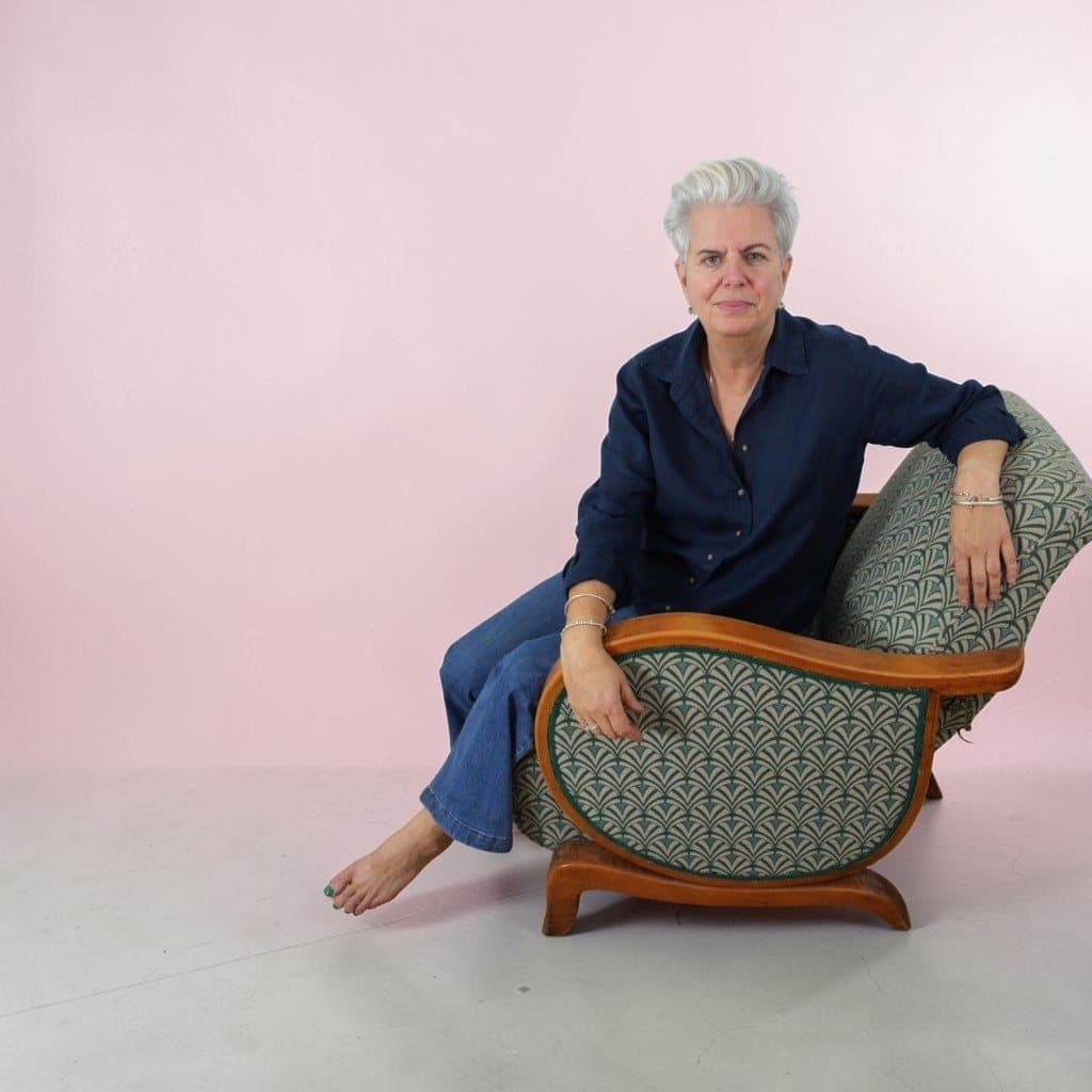 Valérie Hayes seated on the restored chair