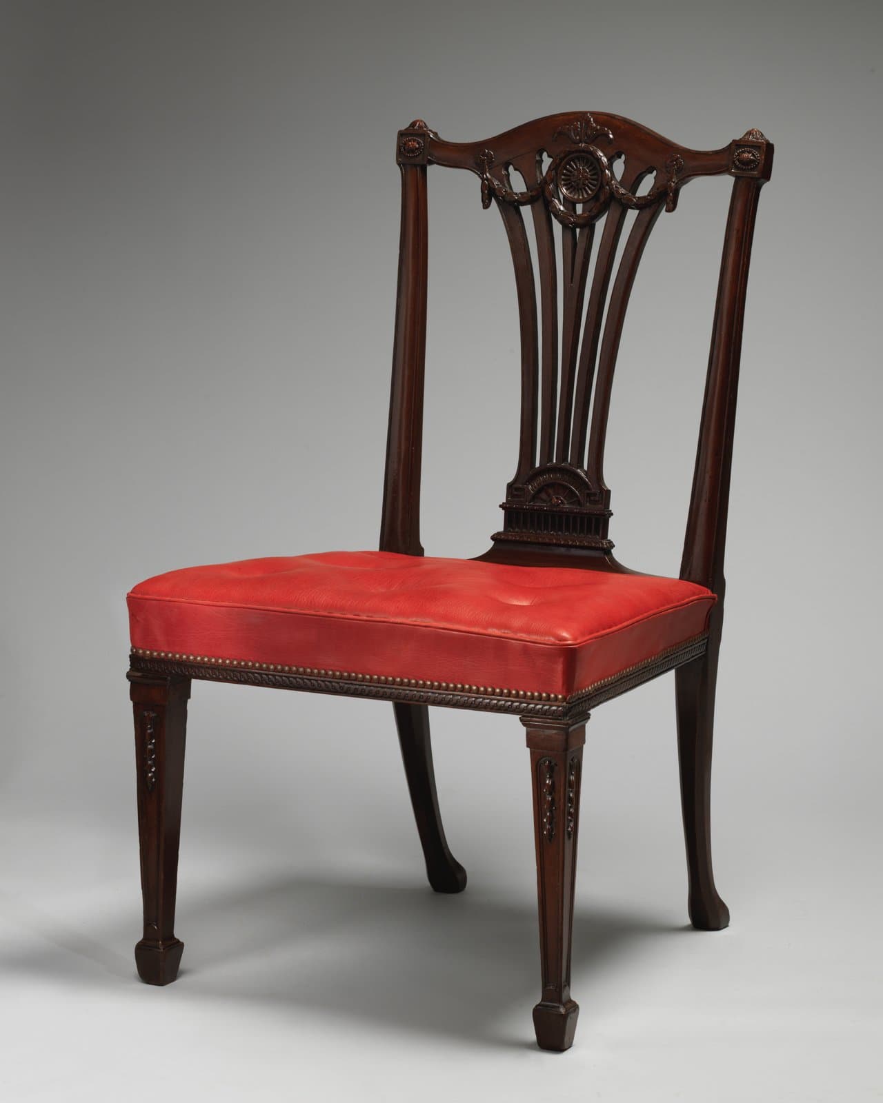 Mahogany side chair with a fan-shaped splat and red leather seat, about 1772, Thomas Chippendale after a design by Robert Adam